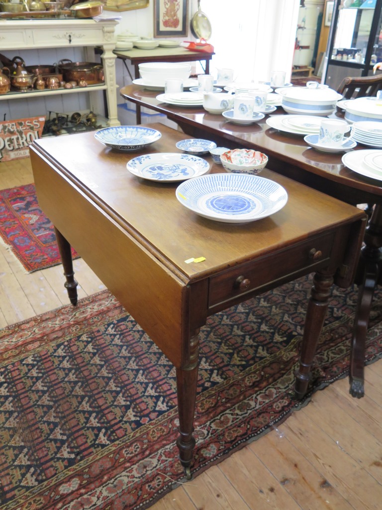 A Victorian mahogany Pembroke table, with frieze drawer, turned legs and brass castors, 97cm wide