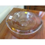 A Swedish glass bowl by Mora Morales - Schildt of oval form with slight brown tint signed Kosta Mona