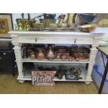 A painted French style buffet, with two frieze drawers over two shelves on husk carved tapering