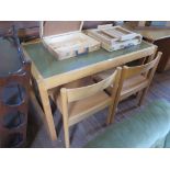 A 1970s ash table with green linoleum top and four dining chairs 121cm x 65cm