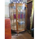 A 1930's walnut bowfront display cabinet on cabriole legs, 87cm wide