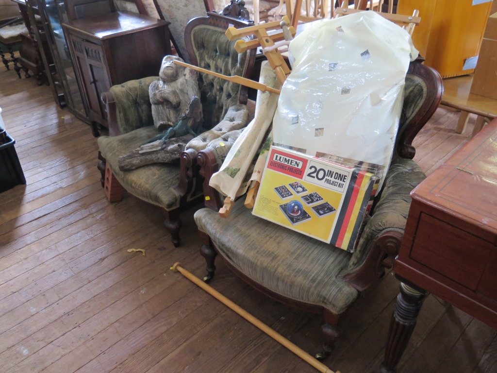 A pair of late Victorian burr walnut and walnut button back armchairs, with carved chevron banded