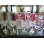 A set of four German crystal goblets, a Dartington crystal jug and vase, and two Webb crystal