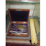 An Edwardian ivory slide rule by Dring & Page 19 & 20 Tooley Street, London, and a rosewood cased