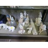 A Lladro figure group of children singing 24cm high, a basalt figure of a Japanese elder 18cm high