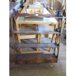 A reproduction George III style mahogany wall hanging plate rack, by Reprodux, with shaped shelves