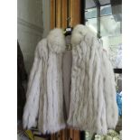 A white fox fur jacket by Saga Fox, size 10