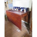 A mahogany and drop leaf dining table on square legs 122cm wide