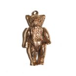 A gold colour articulated teddy bear