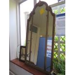 A shaped giltwood wall mirror 109cm x 55.5cm and two others (3)