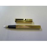 A gold plated Dunhill fountain pen