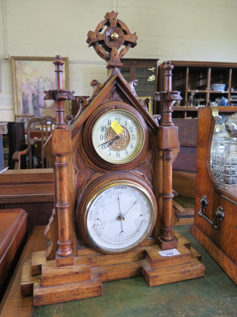 A Victorian oak framed table top compendium of Ecclesiastical form, with time piece, aneroid
