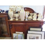 A Victorian mahogany chiffonier, the raised back over two frieze drawers and two panelled doors on a