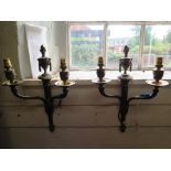 A set of four twin branch wall lights, with swagged urns and fluted tapering stems
