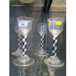 A set of four black and opaque airtwist wine glasses, 20th century, 19cm high