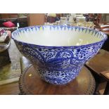 A large blue and white jardiniere, with all over decoration of flowers and exotic birds, repaired,