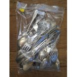 A collection of silver plated forks and spoons