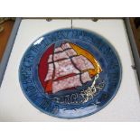 A Poole Pottery 'Festival of the Sea' charger depicting sails with inscribed border', the base