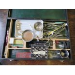 A Rowney drawing box containing surgical clamps, tweezers, measured pipettes and test tubes