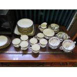 A Wedgwood part tea service with blue and gilt floral borders, seven cups and saucers, twelve side