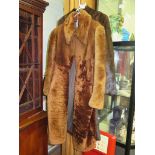 A long mink fur coat and another coat