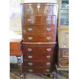 A small mahogany chest on chest, each section with four drawers, on cabriole legs 62cm wide, 140cm