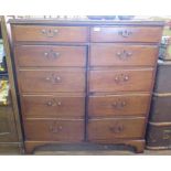 A George III oak cabinet, the two short drawers over a pair of cupboard doors with dummy drawer