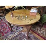 A 1920s mahogany extending D-end dining table, with cabriole legs and ball and claw feet, three