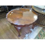 A 1930s walnut pie crust edge coffee table, 60cm diameter, a mahogany bidet and an oak barley-