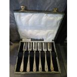 A cased set of silver cake forks