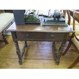 An oak bobbin turned side table, parts possibly 18th century, with rectangular top, frieze drawer