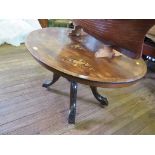 A Victorian inlaid oval table, on four supports and downswept legs, converted into a coffee table,