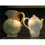 A Clarice Cliff jug, with floral moulded handle and green internal rim, embossed mark and No.895,