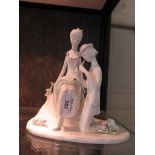 A Rosenthal Studio Line figure group of a couple 'Spring Song', the man kneeling playing a recorder,