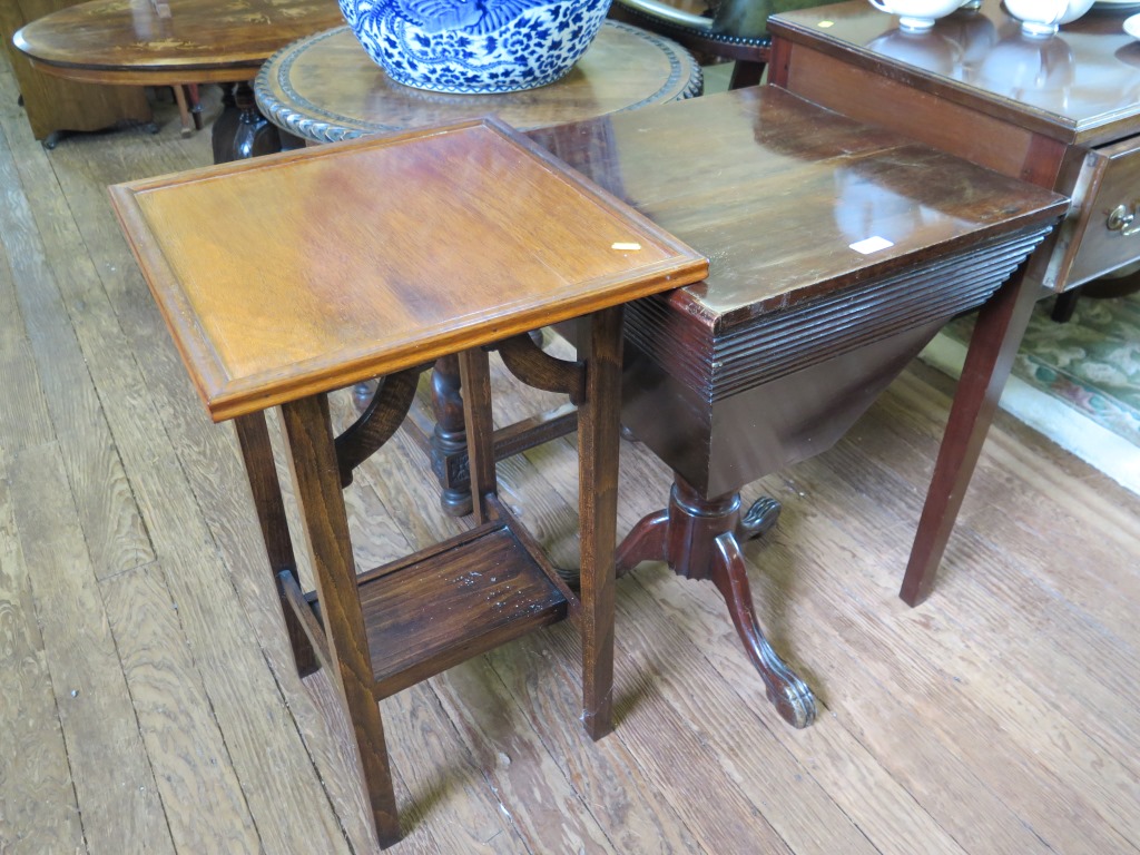 A Victorian sewing table, the square hinged top with tapering sides on a tripod base, 48cm wide