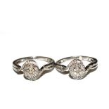 A pair of cross over rings set with round and baguette diamonds marked 925 silver