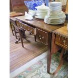 A mahogany ladies kneehole writing desk, with three drawers on square section legs 99cm wide, 47cm