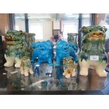 A pair of blue glaze Chinese dogs 17cm high, and two pairs of green glaze seated dogs 25cm and
