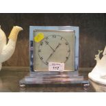 A 1920s chrome double sided desk clock with matted dial, stepped base and pad feet, 14.5cm high