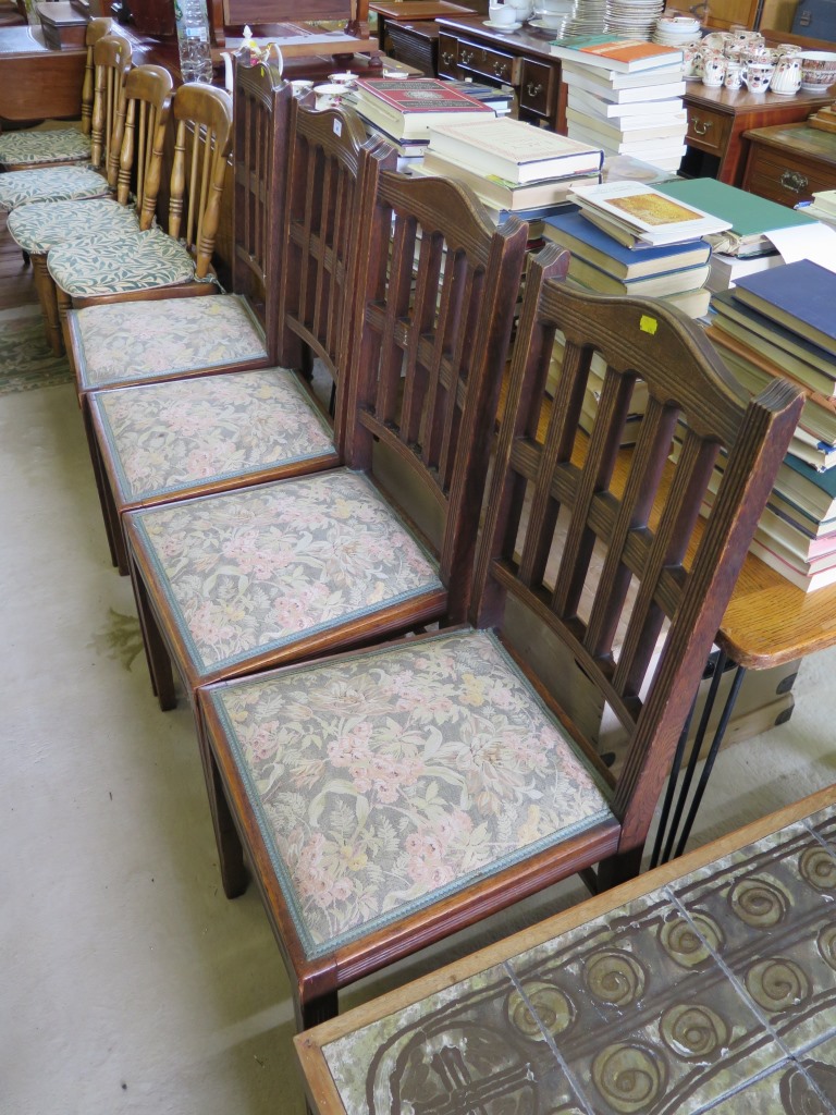 A set of four oak dining chairs, the reeded railbacks on similar square section legs (4)