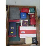 A collection of boxed commemorative coins (one tray)