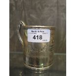 A Victorian silver child's christening mug with engraving to front within a cartouche, London 1868