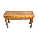 An Art Deco long stool, the square section legs with canted corners, the underside stamped "LCC (