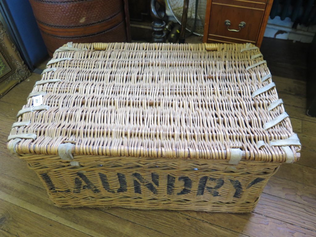 A Whicker laundry basket, painted II Windlesham 77cm wide