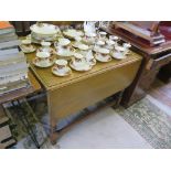 An oak gateleg table, with wide top and narrow leaves on baluster turned legs and block feet with