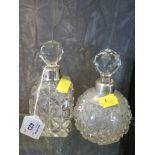 Two glass perfume bottles with silver collars
