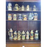 Eighteen various German and Austrian steins, some with lids