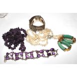 A white metal plaque bracelet, an amethyst bracelet, a rough amethyst bracelet, etc