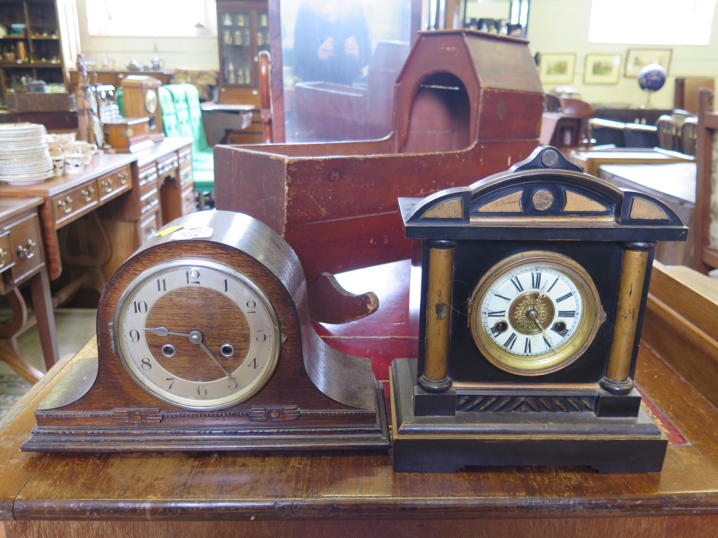 An Edwardian ebonised mantel clock, 32cm high and an Admiral hat clock 38cm (2)