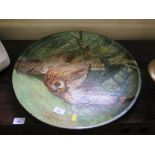 A large charger, possibly Portuguese, depicting an owl caught in a snare, 54cm diameter